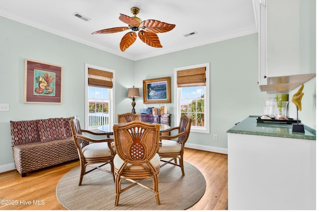 1510 N Shore Dr, Sunset Beach, NC 28468 - dining area featuring light wood-style flooring, ornamental molding, and ceiling fan