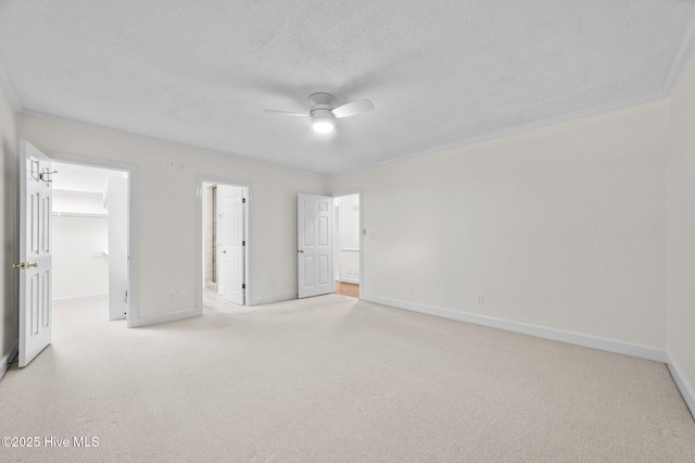 809 Greenbriar Rd, Kinston, NC 28501 - unfurnished bedroom featuring carpet, a walk in closet, baseboards, a textured ceiling, and ensuite bath