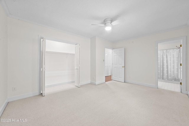 809 Greenbriar Rd, Kinston, NC 28501 - unfurnished bedroom with carpet floors, crown molding, baseboards, a closet, and ensuite bathroom