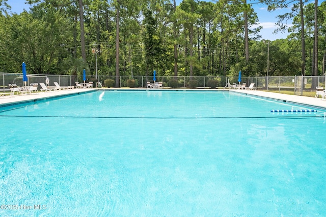 220 Boundary Loop Rd NW, Calabash, NC 28467 - community pool featuring a view of trees