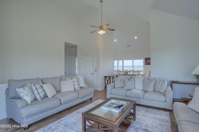 601 New River Inlet Rd, North Topsail Beach, NC 28460 - living area featuring high vaulted ceiling, baseboards, wood finished floors, and a ceiling fan
