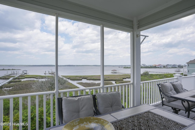 601 New River Inlet Rd, North Topsail Beach, NC 28460 - sunroom featuring a water view and outdoor dining space