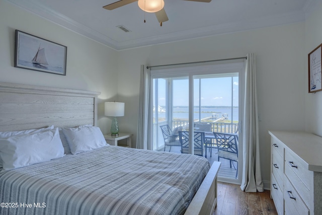 601 New River Inlet Rd, North Topsail Beach, NC 28460 - bedroom with access to exterior, a water view, hardwood / wood-style flooring, crown molding, and a ceiling fan