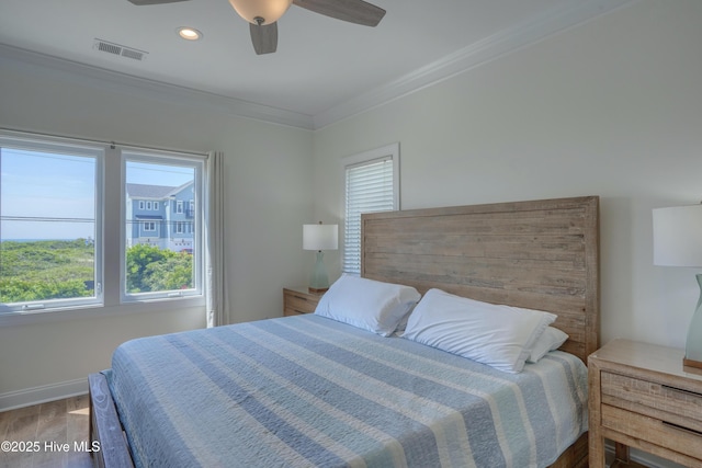 601 New River Inlet Rd, North Topsail Beach, NC 28460 - bedroom with wood finished floors, ornamental molding, baseboards, recessed lighting, and a ceiling fan