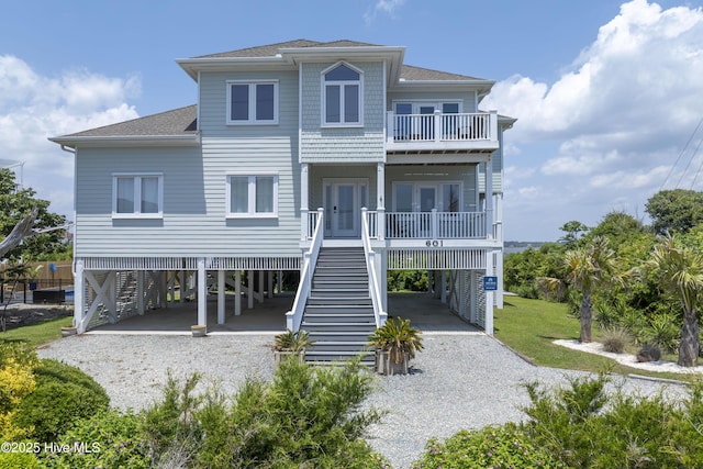 601 New River Inlet Rd, North Topsail Beach, NC 28460 - rear view of property with a carport, driveway, a balcony, and stairway