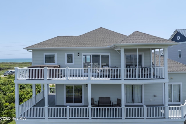 601 New River Inlet Rd, North Topsail Beach, NC 28460 - rear view of house featuring a balcony, roof with shingles, and a water view