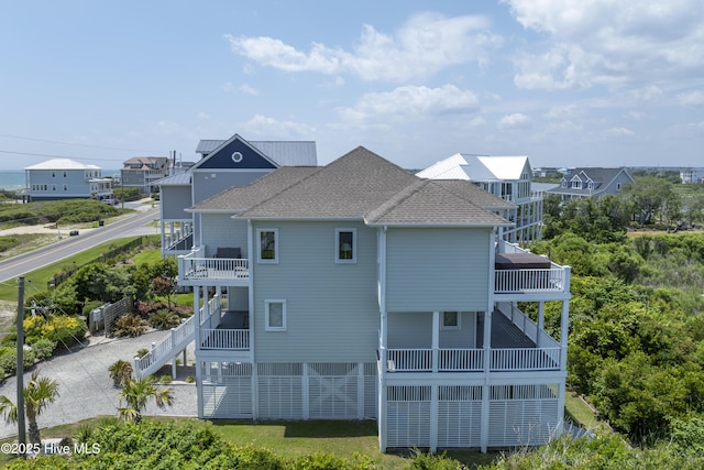 601 New River Inlet Rd, North Topsail Beach, NC 28460 - view of side of home featuring a balcony, roof with shingles, and stairway