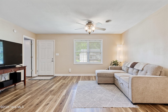 102 Oakwood Ln, Elizabeth City, NC 27909 - living area featuring light wood-style floors, ceiling fan, and baseboards