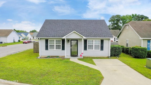 102 Oakwood Ln, Elizabeth City, NC 27909 - bungalow-style house with a front lawn and a shingled roof