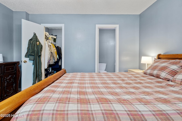102 Oakwood Ln, Elizabeth City, NC 27909 - bedroom with a closet and a textured ceiling