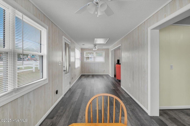3331 Holden Beach Rd SW, Supply, NC 28462 - unfurnished dining area featuring ceiling fan, wood finished floors, a textured ceiling, and wooden walls