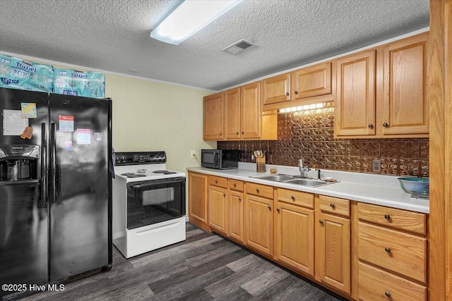 3331 Holden Beach Rd SW, Supply, NC 28462 - kitchen with black appliances, a sink, dark wood-style floors, light countertops, and a textured ceiling