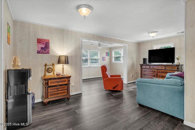 3331 Holden Beach Rd SW, Supply, NC 28462 - living room with wood finished floors, a textured ceiling, ceiling fan, and baseboards