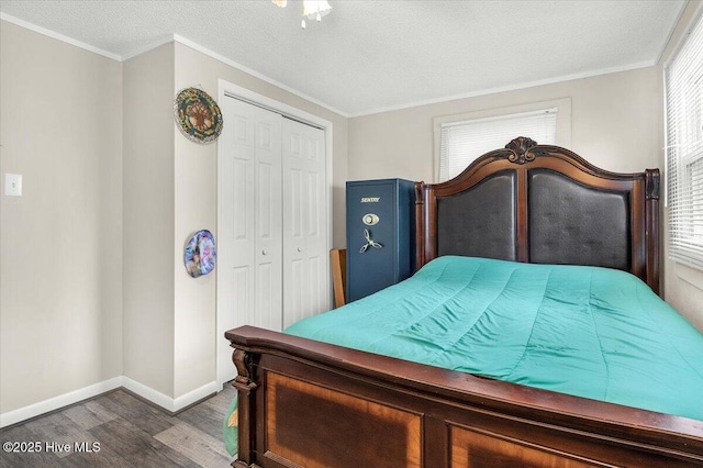 3331 Holden Beach Rd SW, Supply, NC 28462 - bedroom featuring wood finished floors, a closet, baseboards, a textured ceiling, and crown molding