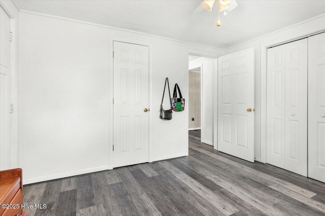 3331 Holden Beach Rd SW, Supply, NC 28462 - unfurnished bedroom featuring wood finished floors, ceiling fan, a closet, baseboards, and ornamental molding