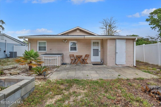 3331 Holden Beach Rd SW, Supply, NC 28462 - back of house with a patio area, central AC unit, and concrete block siding