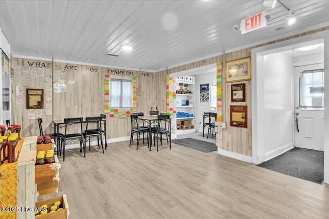 3331 Holden Beach Rd SW, Supply, NC 28462 - miscellaneous room featuring wood finished floors, baseboards, plenty of natural light, and wooden walls