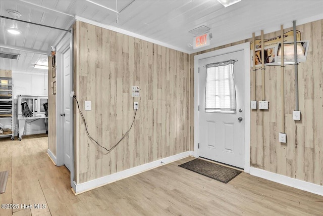 3331 Holden Beach Rd SW, Supply, NC 28462 - entrance foyer featuring wood walls, wood finished floors, and baseboards
