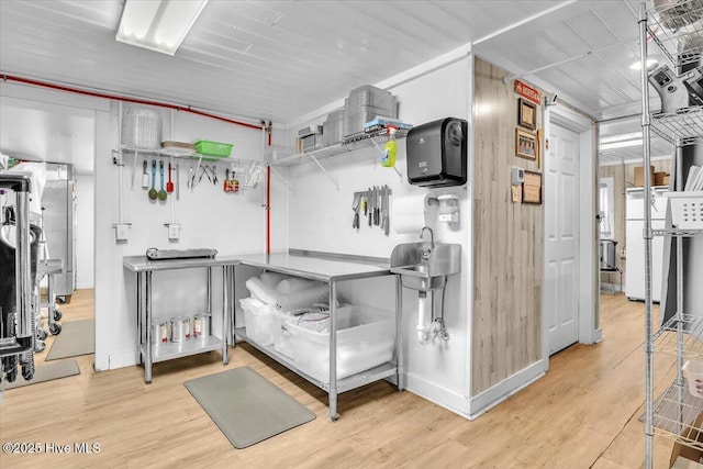 3331 Holden Beach Rd SW, Supply, NC 28462 - misc room with wood finished floors and a sink