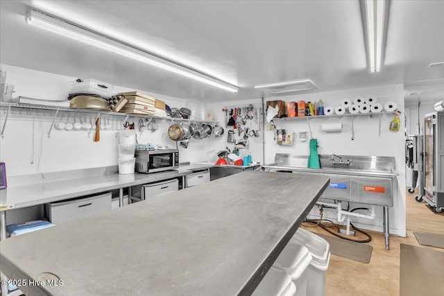 3331 Holden Beach Rd SW, Supply, NC 28462 - kitchen with stainless steel countertops, open shelves, and stainless steel microwave