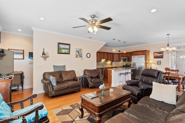 700 S 3rd St, Wilmington, NC 28401 - living area featuring a ceiling fan, a chandelier, recessed lighting, light wood-style flooring, and ornamental molding