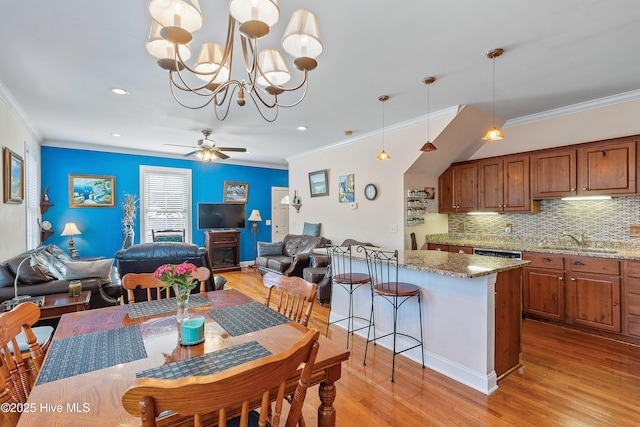 700 S 3rd St, Wilmington, NC 28401 - dining room with crown molding, light wood-style floors, recessed lighting, a ceiling fan, and a chandelier