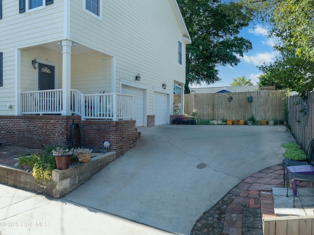 700 S 3rd St, Wilmington, NC 28401 - view of home's exterior with a porch, driveway, and a garage
