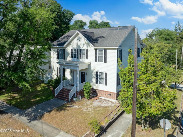 700 S 3rd St, Wilmington, NC 28401 - colonial-style house featuring covered porch, crawl space, a shingled roof, and a front lawn