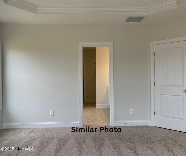 635 Indigo Johnston Dr, Jacksonville, NC 28546 - unfurnished bedroom featuring crown molding, carpet floors, baseboards, and connected bathroom