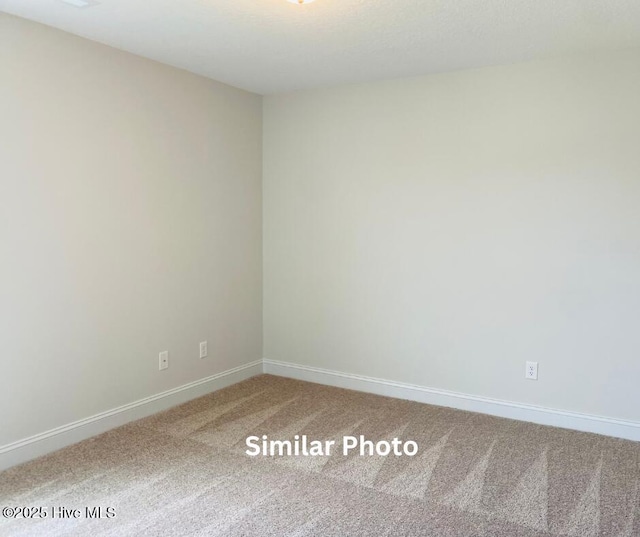 635 Indigo Johnston Dr, Jacksonville, NC 28546 - spare room with carpet flooring and baseboards