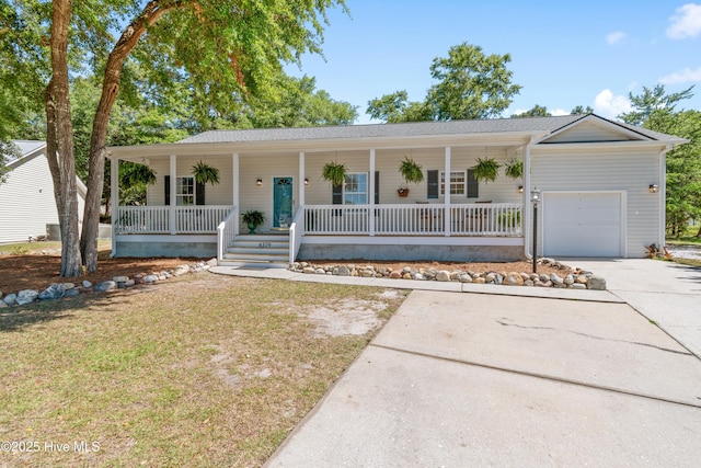 4379 Owendon Dr, Shallotte, NC 28470 - ranch-style home featuring covered porch, an attached garage, concrete driveway, and a front yard