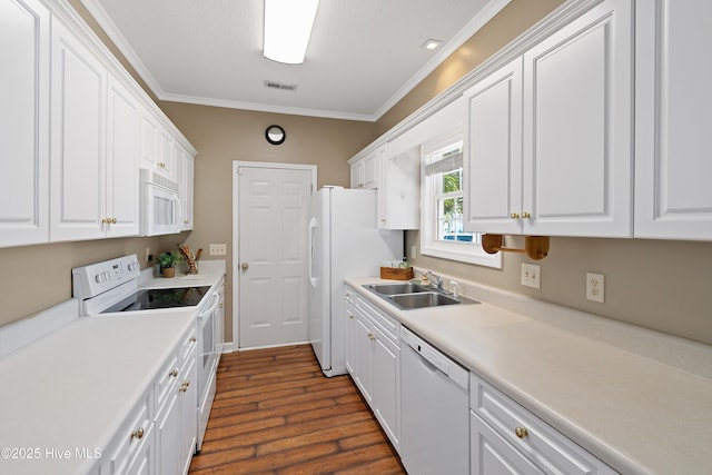 4379 Owendon Dr, Shallotte, NC 28470 - kitchen featuring white appliances, a sink, dark wood finished floors, ornamental molding, and white cabinetry