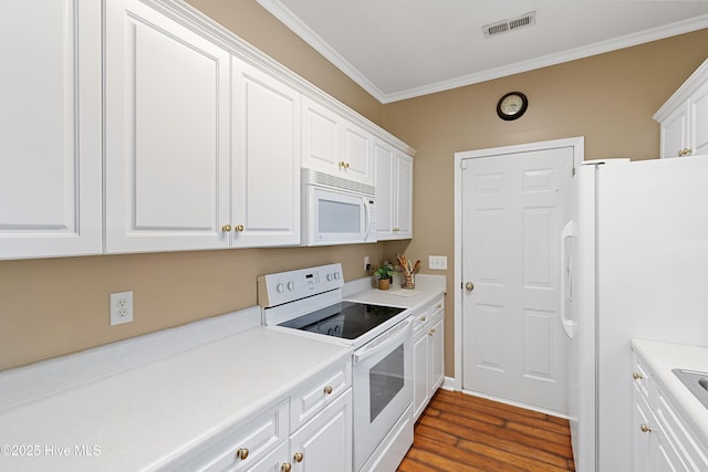 4379 Owendon Dr, Shallotte, NC 28470 - kitchen with white appliances, ornamental molding, white cabinetry, dark wood-type flooring, and light countertops