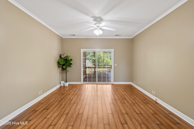 4379 Owendon Dr, Shallotte, NC 28470 - spare room featuring a ceiling fan, baseboards, wood finished floors, and ornamental molding