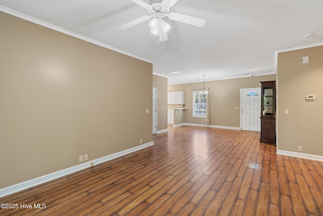 4379 Owendon Dr, Shallotte, NC 28470 - unfurnished living room featuring crown molding, ceiling fan, baseboards, and dark wood-type flooring