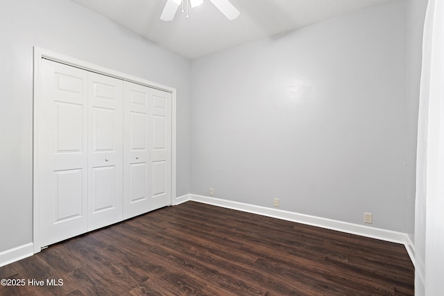4379 Owendon Dr, Shallotte, NC 28470 - unfurnished bedroom featuring dark wood-style flooring, baseboards, a closet, and ceiling fan