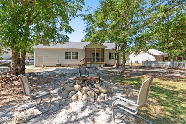 4379 Owendon Dr, Shallotte, NC 28470 - rear view of property with a fire pit, a sunroom, crawl space, and cooling unit