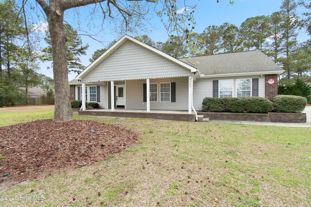 4379 Owendon Dr, Shallotte, NC 28470 - view of front of property featuring covered porch and a front yard