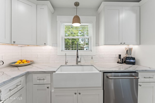 1015 E Moore St, Southport, NC 28461 - kitchen with a sink, tasteful backsplash, white cabinets, dishwasher, and decorative light fixtures
