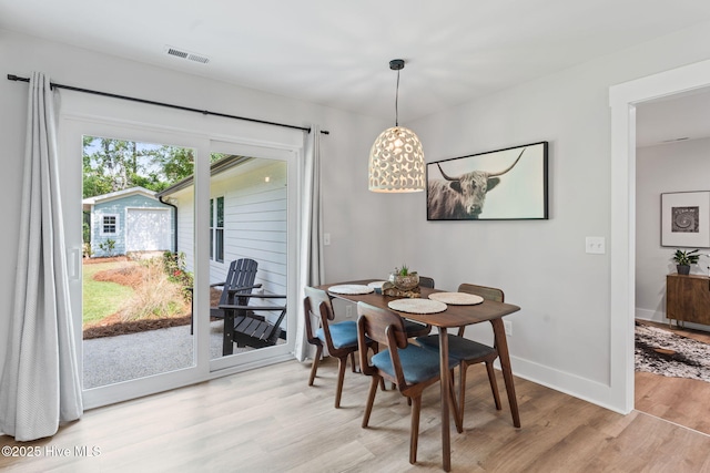 1015 E Moore St, Southport, NC 28461 - dining space with wood finished floors and baseboards