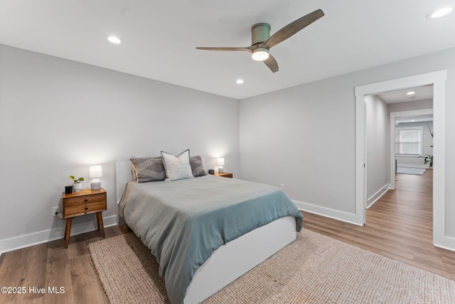 1015 E Moore St, Southport, NC 28461 - bedroom featuring wood finished floors, baseboards, recessed lighting, and a ceiling fan