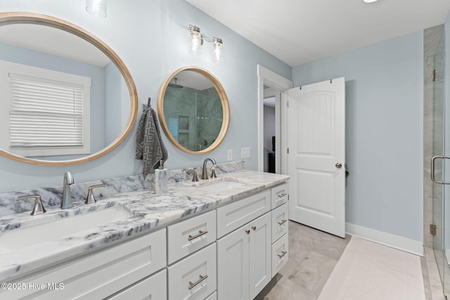 1015 E Moore St, Southport, NC 28461 - bathroom with double vanity, a stall shower, marble finish flooring, and baseboards