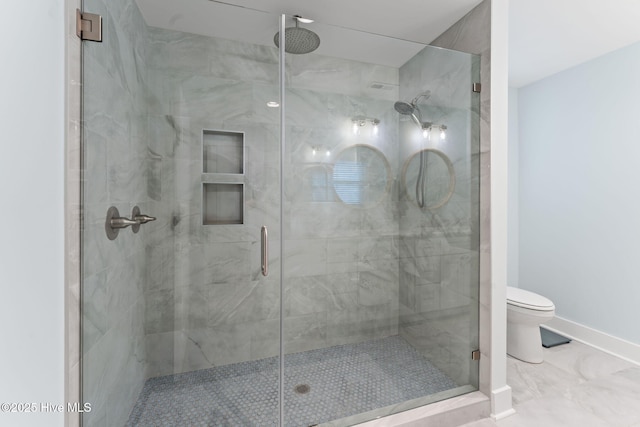 1015 E Moore St, Southport, NC 28461 - full bath featuring a stall shower, toilet, baseboards, and marble finish floors