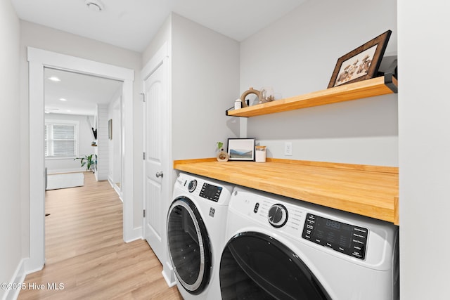 1015 E Moore St, Southport, NC 28461 - laundry room featuring washer and dryer, light wood finished floors, baseboards, and recessed lighting
