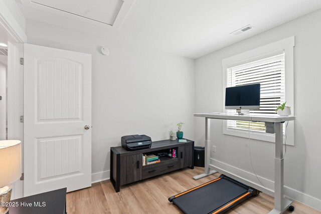 1015 E Moore St, Southport, NC 28461 - exercise room with light wood finished floors and baseboards