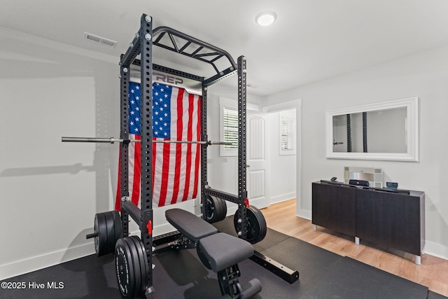 1015 E Moore St, Southport, NC 28461 - workout area with baseboards and wood finished floors