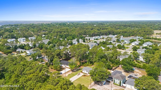 1015 E Moore St, Southport, NC 28461 - aerial view of property and surrounding area featuring nearby suburban area and a forest