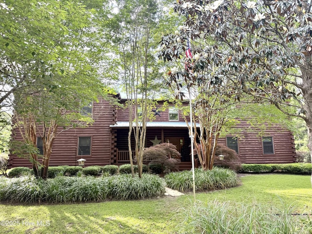 520 Holly Ridge Rd, Holly Ridge, NC 28445 - back of house with log siding and a lawn