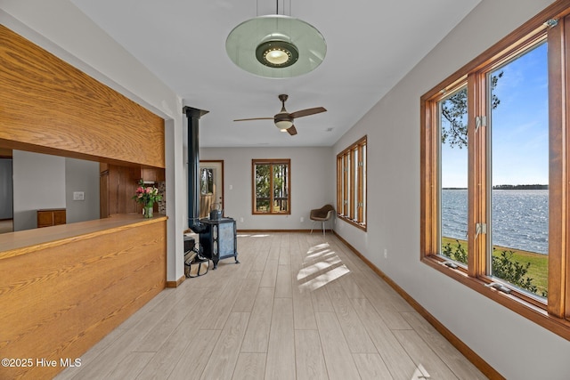 153 Windmill Point Dr, Vandemere, NC 28587 - hallway featuring a water view, light wood-style floors, and baseboards
