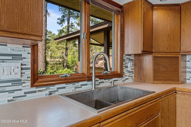 153 Windmill Point Dr, Vandemere, NC 28587 - kitchen featuring a sink, decorative backsplash, and light countertops